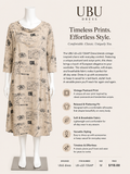 UBU dress with vintage postcard print on a mannequin against a white background